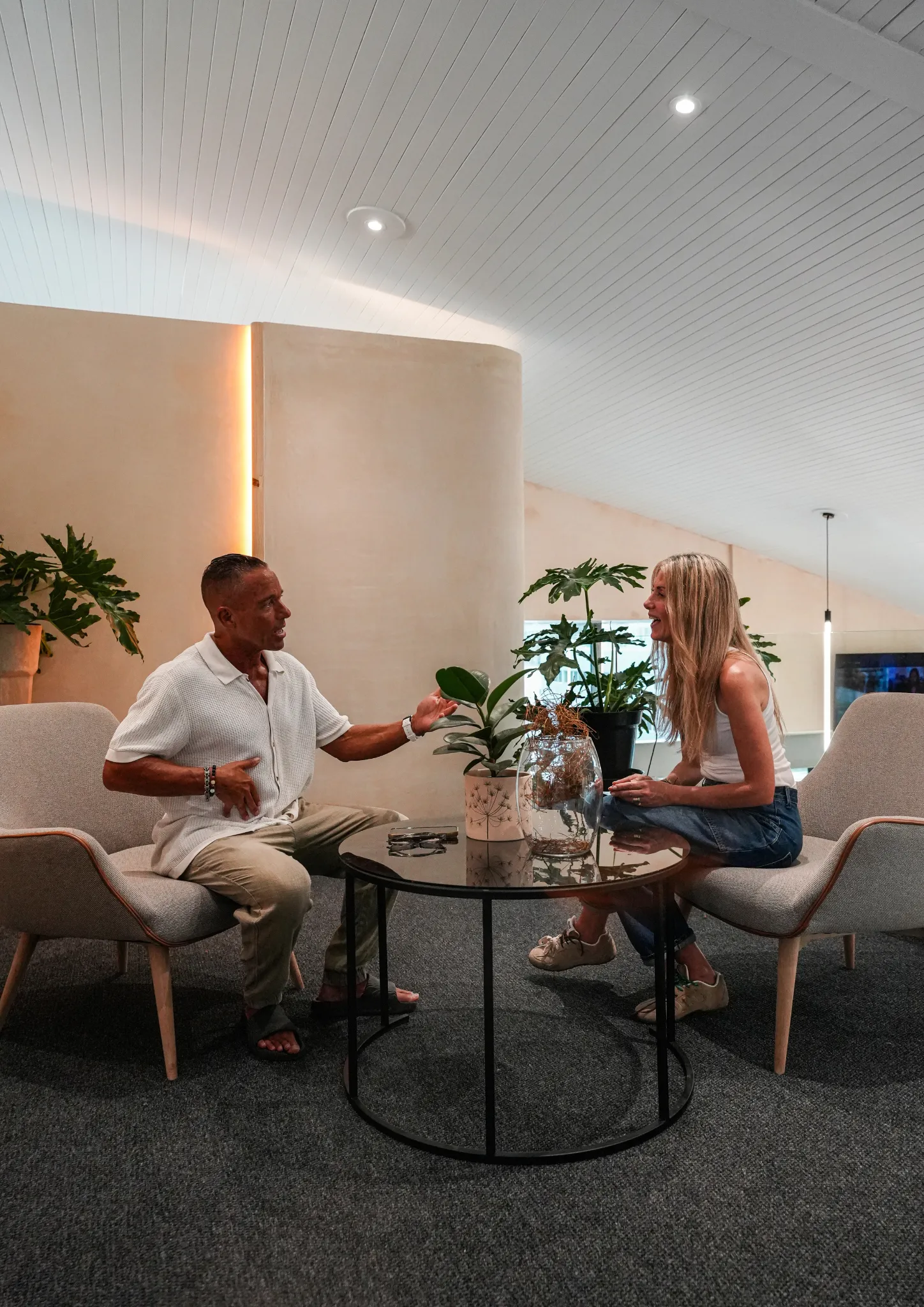 WellNest performance space with curved staircase and training floor beyond