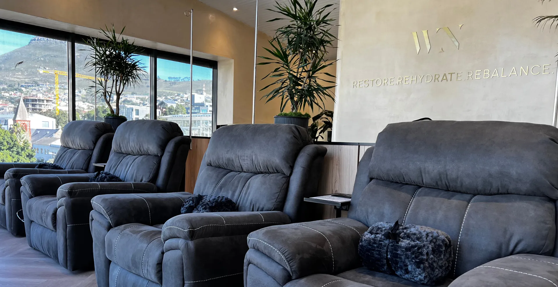 WellNest IV therapy lounge: recliners with views over Cape Town