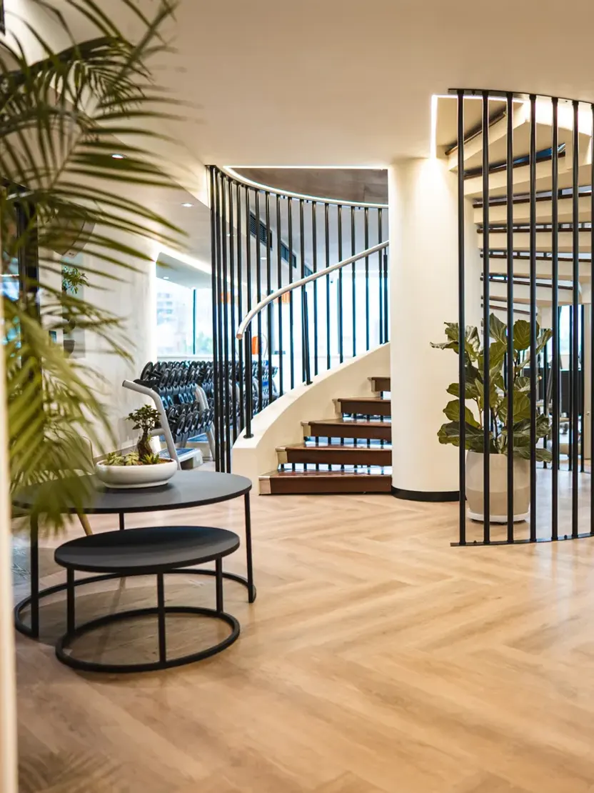 The lounge beside the spiral staircase at WellNest Gold, Cape Town