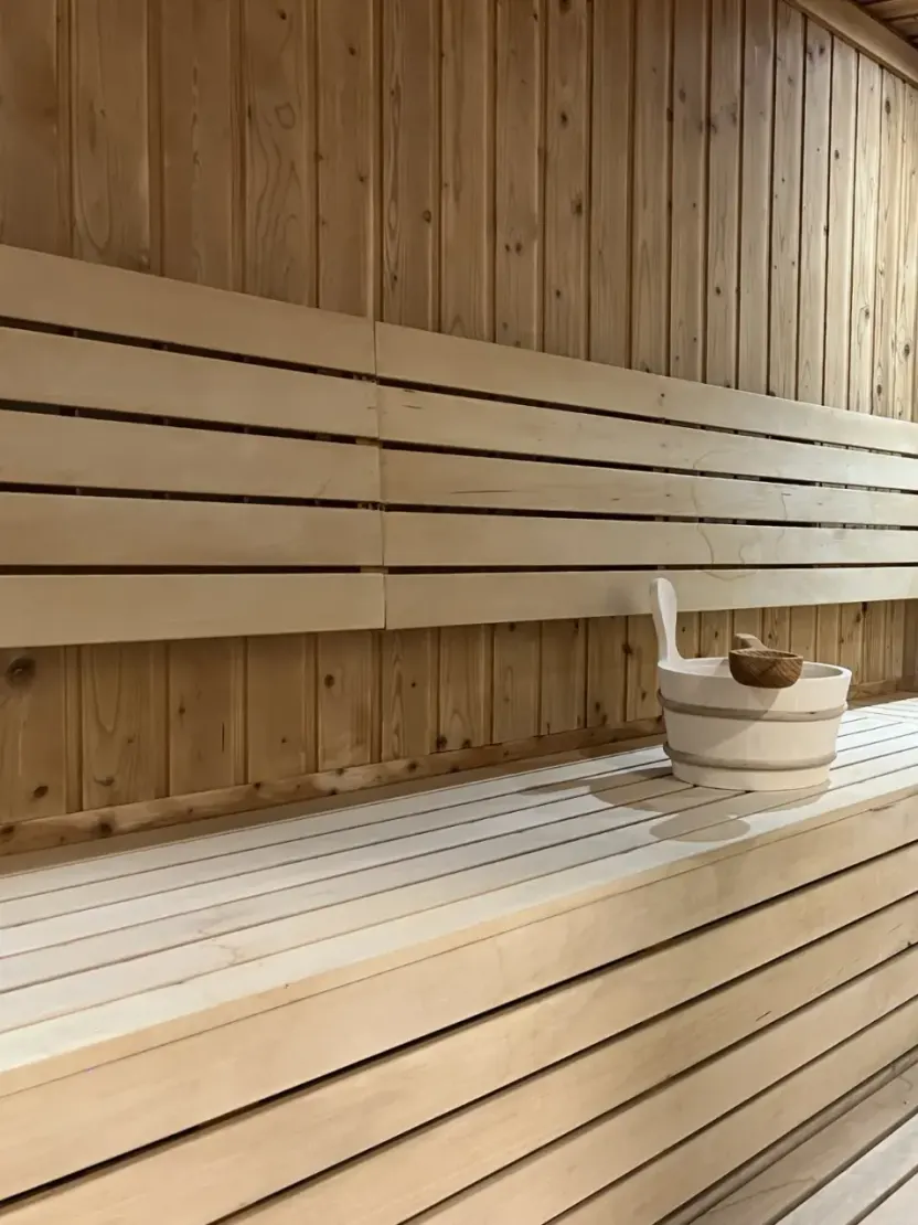 Cedar benches in the private sauna at WellNest Gold, Cape Town
